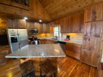 Kitchen with granite counter tops and stainless applainces 